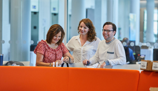 three-employees-smiling-after-a-meeting